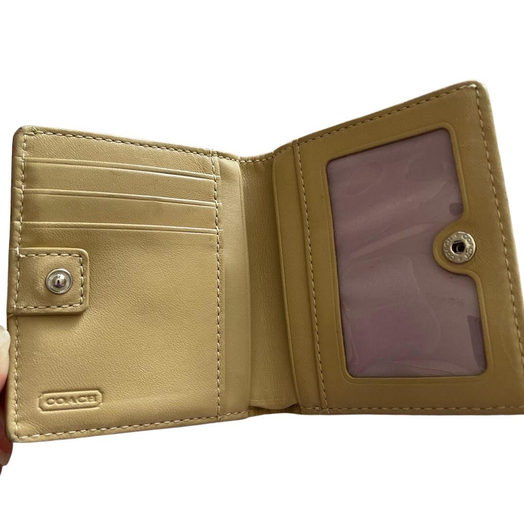 Coach Signature C Brown Tan Small Wallet (Category: Wallets & Card holders) located in Davao. Submitted by ghoulsnightincloset (Listing ID 1470857464, Image 2). Description: .•COLOR: Brown/Beige Signature Canvas with Tan Leather Trim (Lavender Interior) .•STYLE: Compact Bifold Wallet with Back Zippered Coin Purse & ID Window .•CONDITION: Preloved with signs of use, minor rubbing on leather/edges, but fully functional ୨୧ PRE-ORDER FROM JAPAN 🇯🇵 