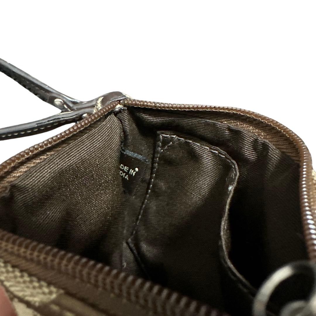 Coach Signature Wristlet (Category: Luxury Bags & Wallets) located in Davao. Submitted by ghoulsnightincloset (Listing ID 1470852900, Image 3). Description: .•COLOR: Khaki/Beige Signature Canvas with Dark Brown Stripe & Leather Strap .•STYLE: Signature Canvas Pouch Wristlet / Coin Case .•CONDITION: Preloved with visible signs of use and minor discoloration ୨୧ PRE-ORDER FROM JAPAN 🇯🇵 ⏳ ETA: 2–3 weeks .• SP: 2,200 • 3-weeks layaway available • 30