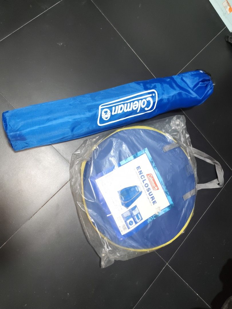 Coleman Enclosure Pop-Up Tent Blue (Category: Hiking & Camping) located in San Juan City. Submitted by swiftfox.62e2f4 (Listing ID 1470766191, Image 1). Description: - Brand: Coleman - Color: Vibrant blue and yellow - Condition: Brand new, still in original plastic packaging, stored indoors - Portability: Packs down flat into a compact circular carry bag - Included: Matching blue Coleman storage sleeve and poles - Best for: Camping, beach trips, 