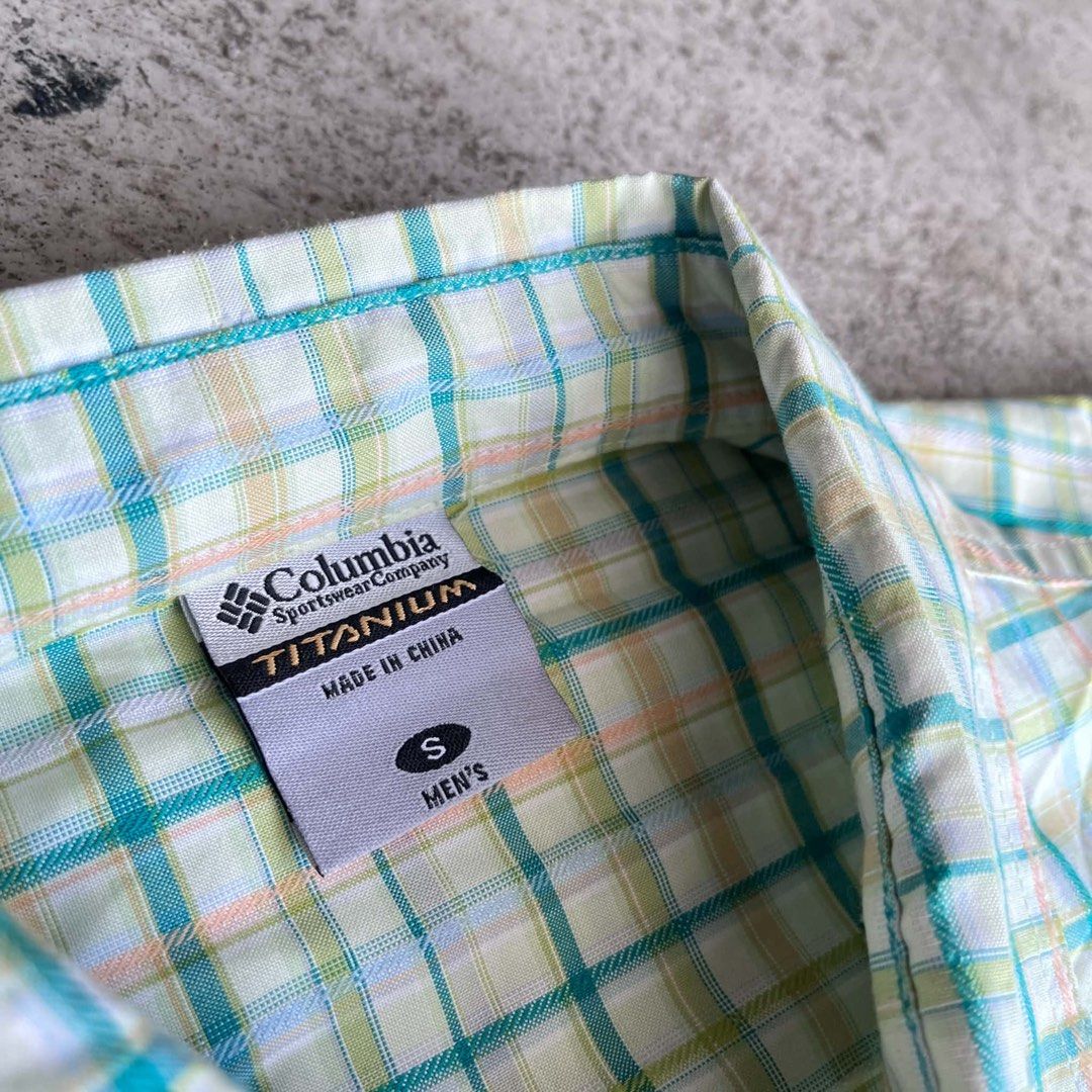 Columbia Titanium Men's Short Sleeve (Category: Tshirts & Polo Shirts ) located in Caloocan City. Submitted by landcruiser76__ (Listing ID 1470777776, Image 2). Description: - Brand: Columbia Titanium - Style: Men's short-sleeve button-down shirt - Size: Small (Regular Fit) - Color/Pattern: Plaid in teal, yellow, green, and white - Details: Branded buttons, Columbia Titanium tag near hem - Material: Lightweight fabric Condition : good condish Siz