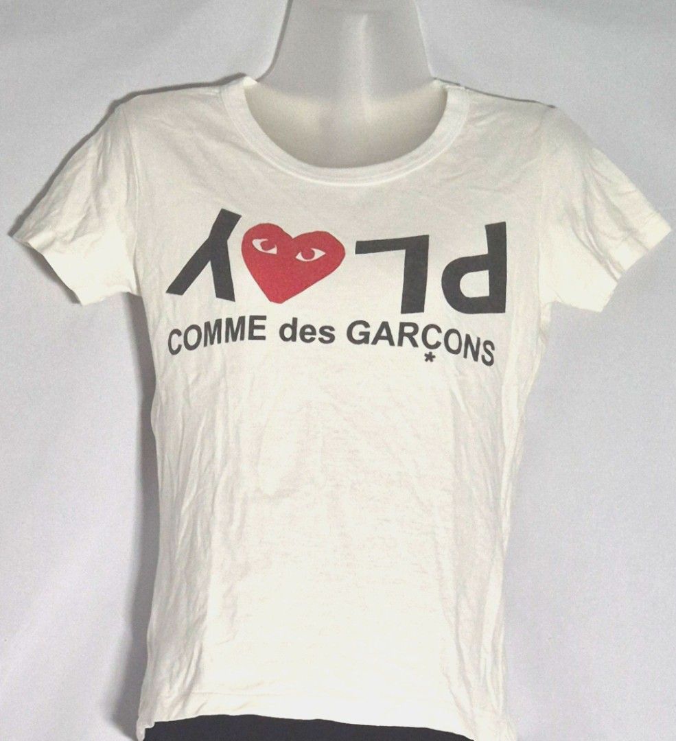 Comme des Garçons PLAY Inverted Text T-shirt (Category: Shirts) located in Antipolo. Submitted by saribymonica (Listing ID 1470866650, Image 1). Description: Size: small ✨ PLEASE READ BEFORE PURCHASING ✨ • Items have been stored in the cabinet and may be wrinkled or need ironing. • Colors may vary slightly due to lighting and screen settings. • Please check all photos carefully before purchasing. • Any visible flaws noticed during inspection will