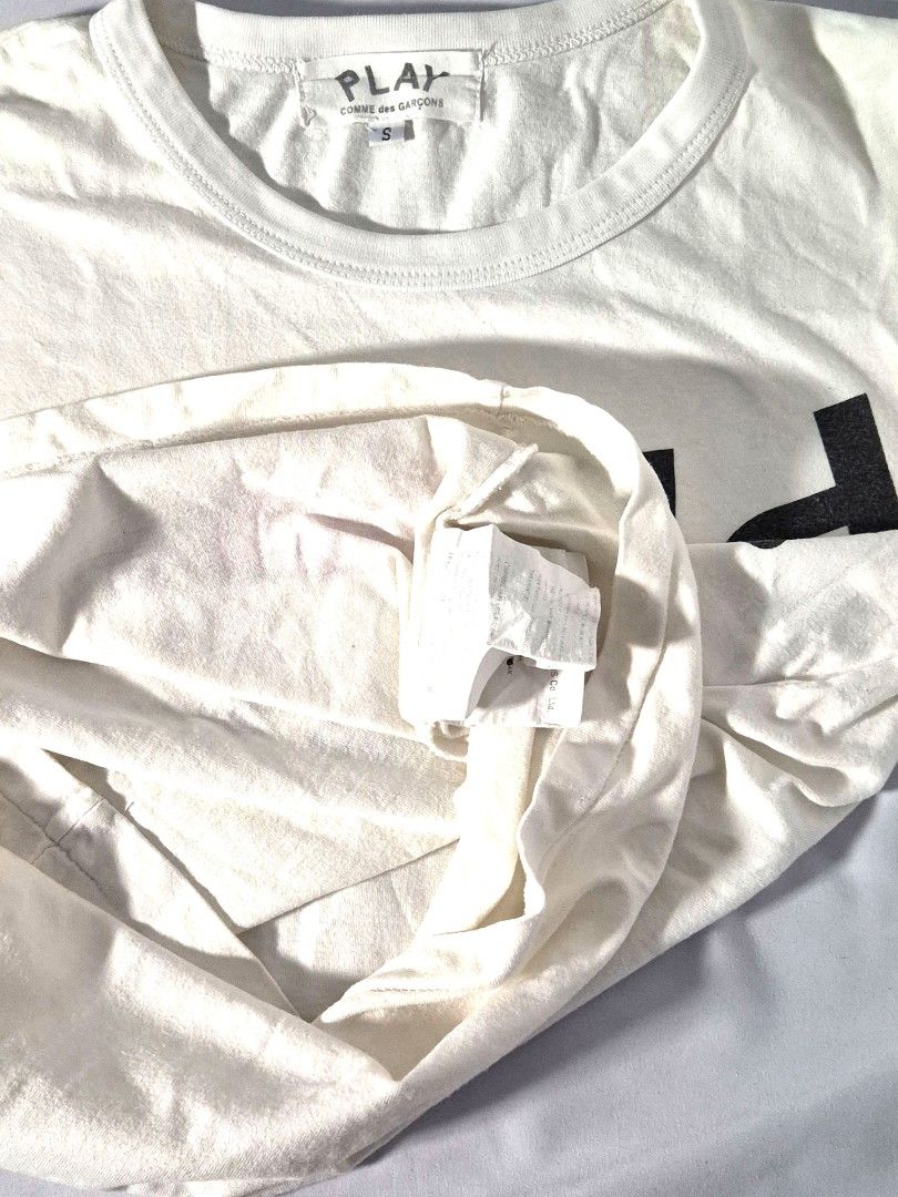 Comme des Garçons PLAY Inverted Text T-shirt (Category: Shirts) located in Antipolo. Submitted by saribymonica (Listing ID 1470866650, Image 3). Description: Size: small ✨ PLEASE READ BEFORE PURCHASING ✨ • Items have been stored in the cabinet and may be wrinkled or need ironing. • Colors may vary slightly due to lighting and screen settings. • Please check all photos carefully before purchasing. • Any visible flaws noticed during inspection will