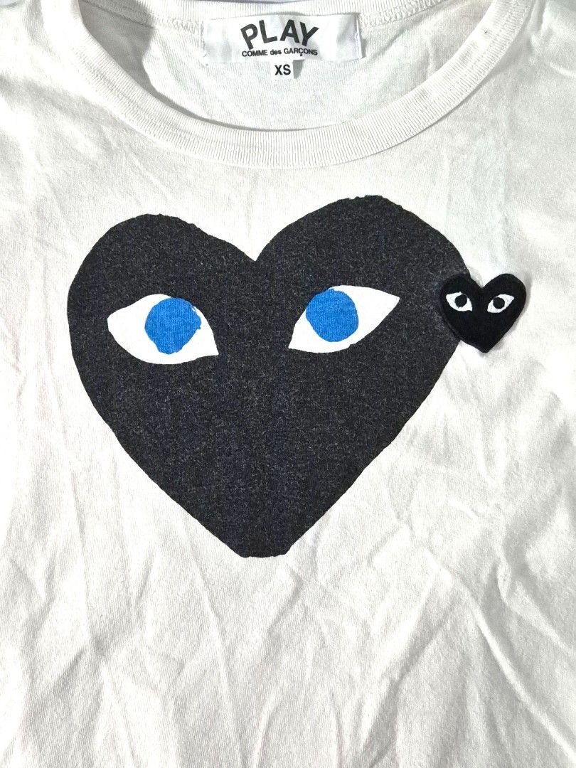 Comme des Garçons PLAY Tee (Category: Shirts) located in Antipolo. Submitted by saribymonica (Listing ID 1470875528, Image 2). Description: Size: XS • Stored in the cabinet, so the item may be wrinkled and may need ironing. • Colors may vary slightly due to lighting and screen settings. • Please check all photos carefully before purchasing. • Sold as is. No returns, refunds, or exchanges once sold. • Serious buyers only. Please respect each other