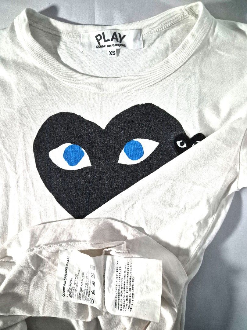 Comme des Garçons PLAY Tee (Category: Shirts) located in Antipolo. Submitted by saribymonica (Listing ID 1470875528, Image 3). Description: Size: XS • Stored in the cabinet, so the item may be wrinkled and may need ironing. • Colors may vary slightly due to lighting and screen settings. • Please check all photos carefully before purchasing. • Sold as is. No returns, refunds, or exchanges once sold. • Serious buyers only. Please respect each other