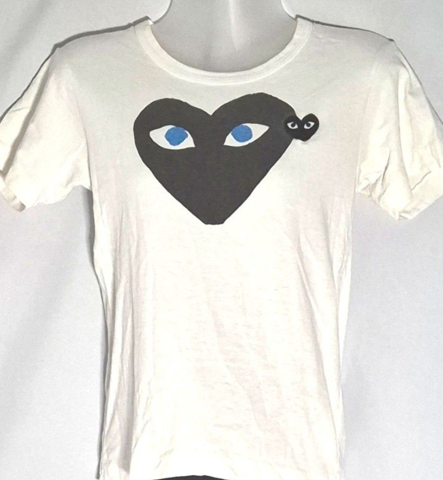 Comme des Garçons PLAY Tee (Category: Shirts) located in Antipolo. Submitted by saribymonica (Listing ID 1470875528, Image 1). Description: Size: XS • Stored in the cabinet, so the item may be wrinkled and may need ironing. • Colors may vary slightly due to lighting and screen settings. • Please check all photos carefully before purchasing. • Sold as is. No returns, refunds, or exchanges once sold. • Serious buyers only. Please respect each other
