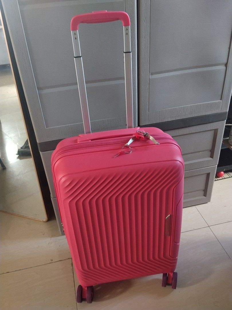 Compass Pink Hard Case Luggage With Lock (Category: Luggage) located in Quezon City. Submitted by shine_my_preloved (Listing ID 1470789557, Image 1). Description: Selling my cute pink travel luggage! 💗🧳 ✨ Details: - Color: Pink - Stylish ribbed pattern - Hard-shell suitcase - Included the Key and lock - Passcode - Handle: Extendable trolley handle - Closure: Zipper - Perfect for up to 7 Kilos - Good Condition and Slight use - No damaage 📍 Loca