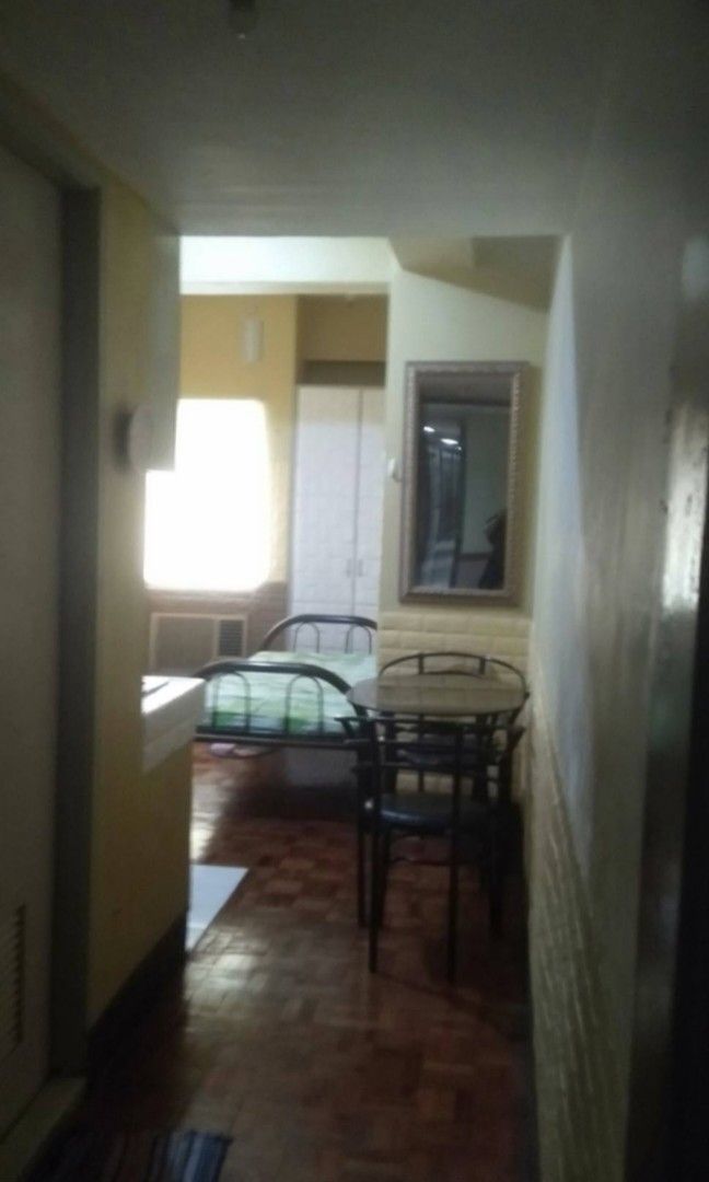 Condominium for rent (Category: Apartments & Condos) located in Manila. Submitted by clevercrystal.e61a9a (Listing ID 1470785609, Image 2). Description: Affordable Condo Unit for Rent - Monthly Rate: PHP 12,500 only - Furnished with bed, dining table, and refrigerator - Kitchen counter with sink and built-in cabinets - Separate bathroom with toilet and sink - Elegant wooden flooring in the main area - Well-lit space with great natural light - DM 