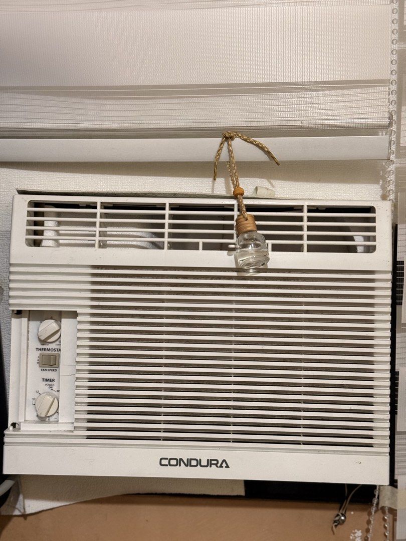 Condura 6S Window Type Air Conditioner WCONZ006EC (Category: Air Conditioning and Heating) located in Muntinlupa City. Submitted by cynthiacarriscanindo (Listing ID 1470859073, Image 1). Description: - Brand: Condura Window Type Aircon - Model: WCONZ006EC (0.5 HP conventional) - Controls: Easy manual knobs for thermostat, fan speed, and timer - Design: White plastic casing with classic horizontal grill - Efficiency: Includes energy savings plug w
