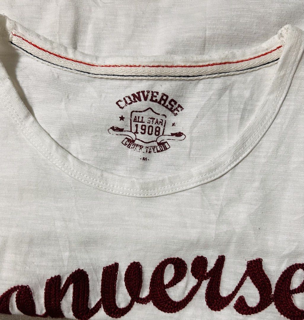 CONVERSE (Category: Shirts) located in Davao. Submitted by sart0ria85 (Listing ID 1470858707, Image 3). Description: An offwhite TSHIRT with text prints in maroon. 65%POLYESTER 35%COTTON MADE IN CHINA 🇨🇳 MEDIUM. Size 6 EXCELLENT CONDITION (92/100).