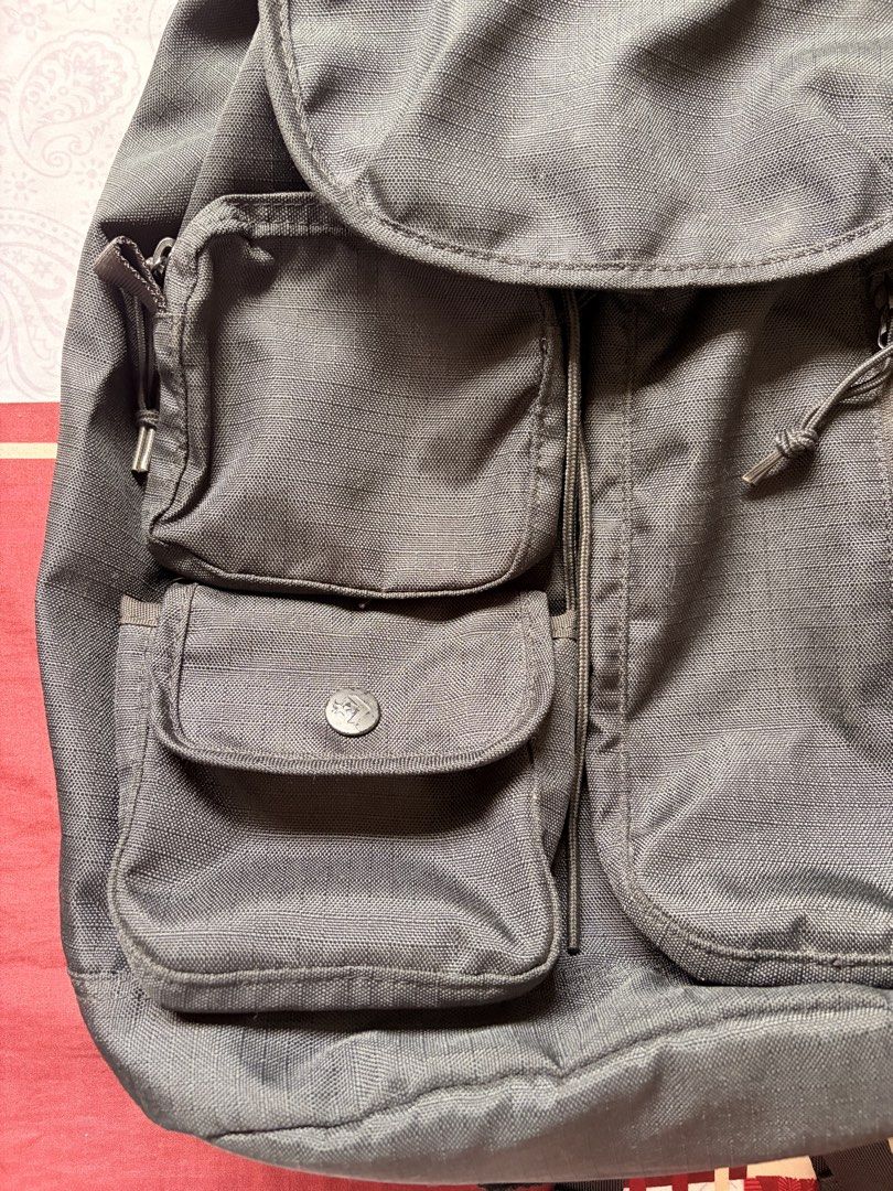Converse Black Utility Backpack (Category: Backpacks) located in Cainta. Submitted by vlera (Listing ID 1470767504, Image 3). Description: - Multiple Pockets - Brand: Converse - Color: Classic Black - Material: Durable high-quality canvas - Storage: Main flap closure, top zipper pocket, front zippered compartment, and buttoned pouch - Comfort: Adjustable padded shoulder straps with woven branding and a convenient top grab handle - Perfect for: Sc