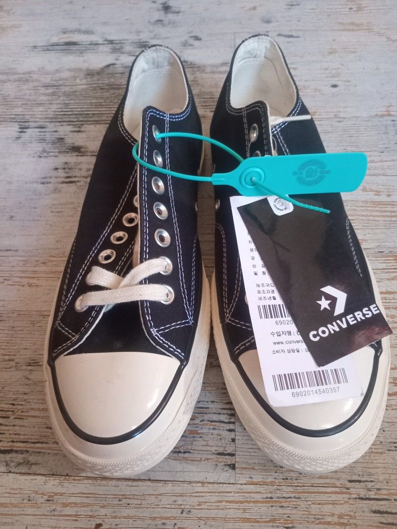 Converse Chuck Taylor All Star Black Sneakers (Category: Sneakers) located in Quezon City. Submitted by jdmagallanes29 (Listing ID 1470770905, Image 1). Description: - Brand: Converse - Style: Low-top canvas sneakers - Color: Black with white toe cap, contrast stitching, and brown rubber sole - Condition: Brand new, never worn - Inclusions: Original tags and authentication tag attached - Mode of Payment: GCash, BPI, or Bank Transfer - Shipping: V