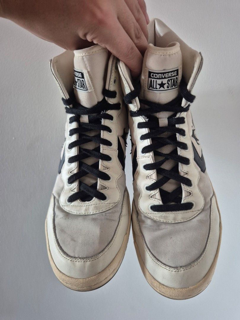Converse Star Player High Top Sneakers Off-White Black (Category: Sneakers) located in Makati City. Submitted by tapsj (Listing ID 1470817122, Image 2). Description: - Brand: Converse - Style: High top sneakers (off-white and black with classic star chevron logo) - Size: US Men's 10 / US Women's 11.5 - Features: Black laces, padded collar, durable rubber outsole - Condition: Minor dirt marks on canvas upper and midsoles from regular use; soles st