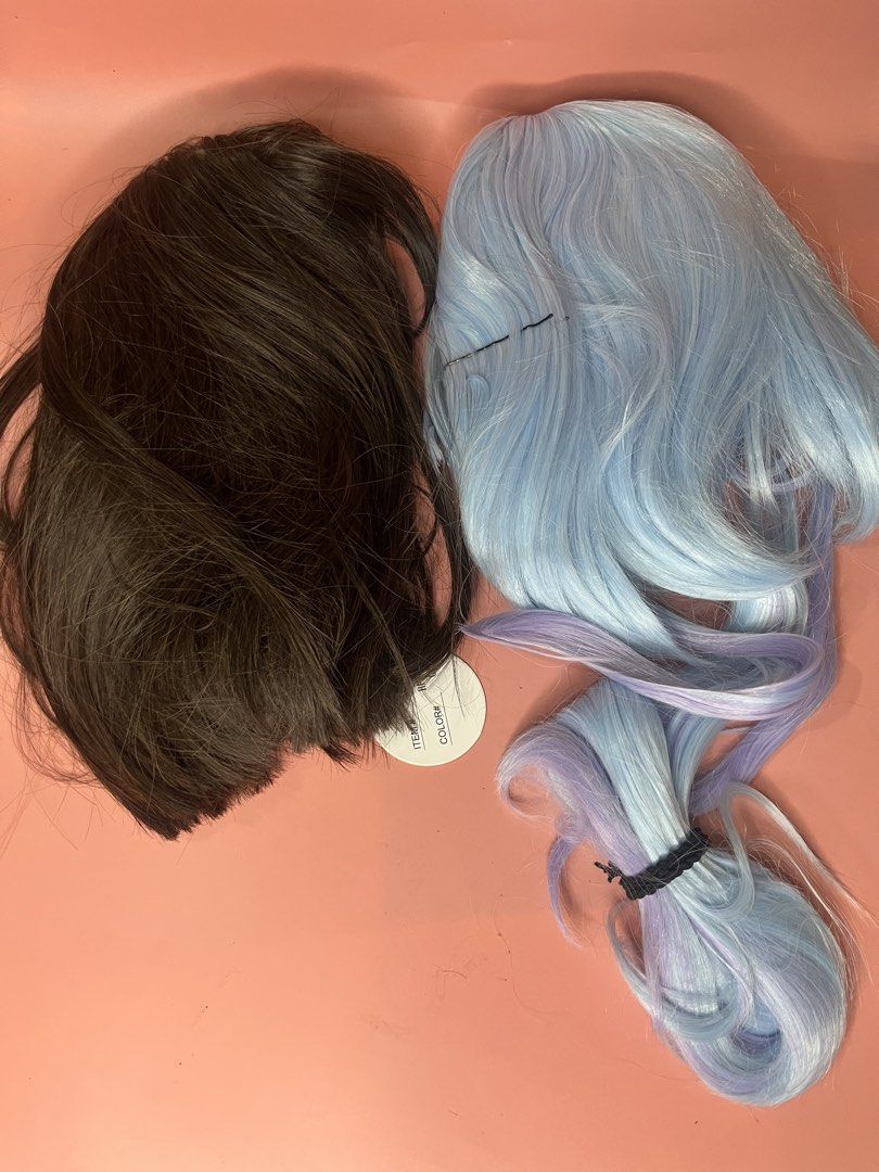 Cosplay Wigs Assorted Colors and Styles (Category: Hair Accessories) located in Caloocan City. Submitted by snapshop_ph (Listing ID 1470818957, Image 2). Description: Collection of cosplay wigs in vibrant neon green, bright pink, black and white split dye, natural brown, and pastel blue with purple ends. Includes Delusion Anime branded tags and packaging nets. Synthetic hair fibers, various lengths and cuts. Great for dress-up, conventions, and c