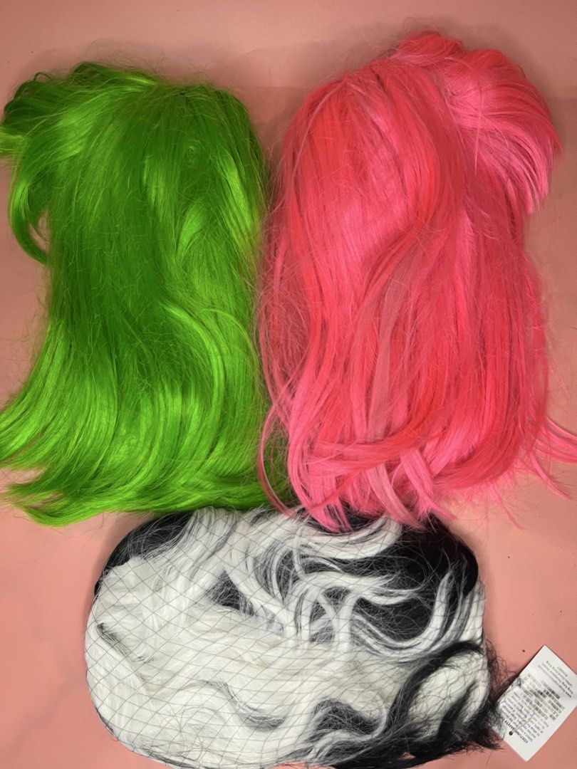 Cosplay Wigs Assorted Colors and Styles (Category: Hair Accessories) located in Caloocan City. Submitted by snapshop_ph (Listing ID 1470818957, Image 1). Description: Collection of cosplay wigs in vibrant neon green, bright pink, black and white split dye, natural brown, and pastel blue with purple ends. Includes Delusion Anime branded tags and packaging nets. Synthetic hair fibers, various lengths and cuts. Great for dress-up, conventions, and c