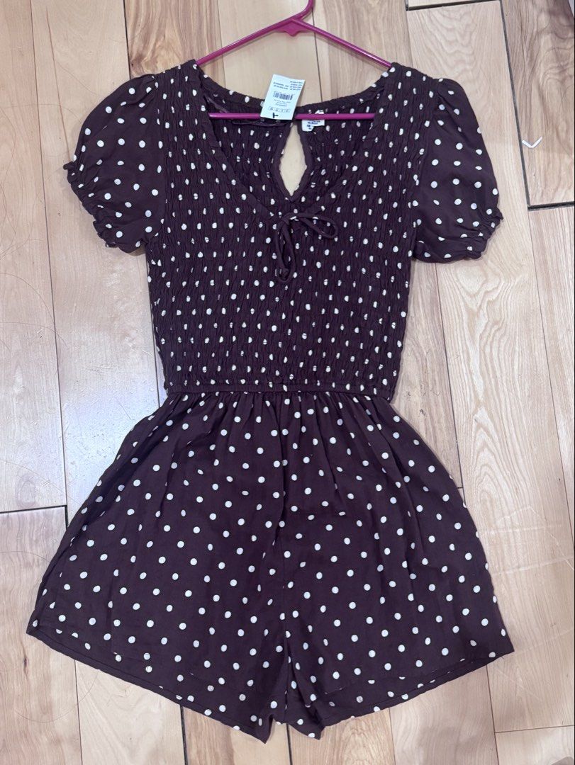 Cotton On Polka dot romper chocolate brown (Category: Rompers) located in Abucay. Submitted by a.lovescloset (Listing ID 1470850777, Image 1). Description: - Brand: Cotton On - Brand new with tags (BNWT) - Brown with white polka dots - Design: Smocked bodice, puff sleeves with elastic cuffs, front tie detail, and keyhole cutout - Material: Lightweight and breathable - Size: Standard fit.