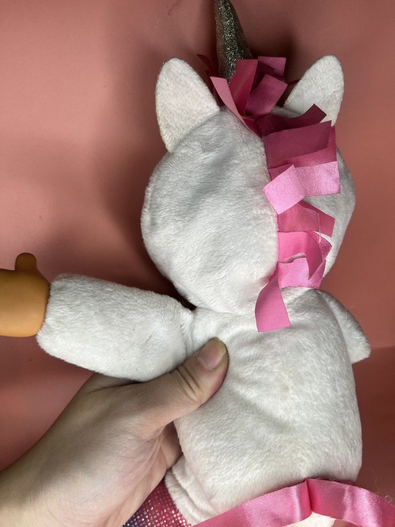 CPK Cabbage Patch Kids Unicorn Plush Doll (Category: Plushies & Soft Toys) located in Caloocan City. Submitted by snapshop_ph (Listing ID 1470818608, Image 3). Description: - Authentic Cabbage Patch Kids unicorn plush toy with original CPK fabric tag - Features a sparkly silver horn and bright green eyes - Colorful rainbow glitter belly with pink ribbon mane and tail - White plush body with glittery multicolored hooves - Super soft, clean overall