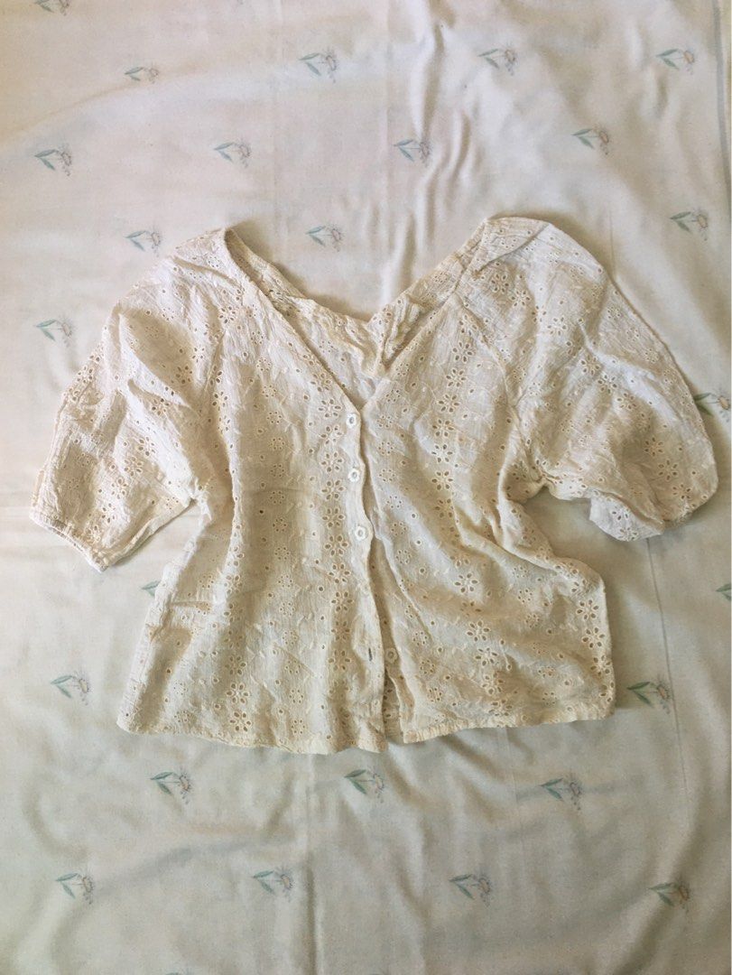 Cream Eyelet Lace blouse (Category: Blouses) located in Cabuyao City. Submitted by 4everblooms (Listing ID 1470773491, Image 1). Description: - Size: S - M - Details: Short puff sleeves, V-neckline.