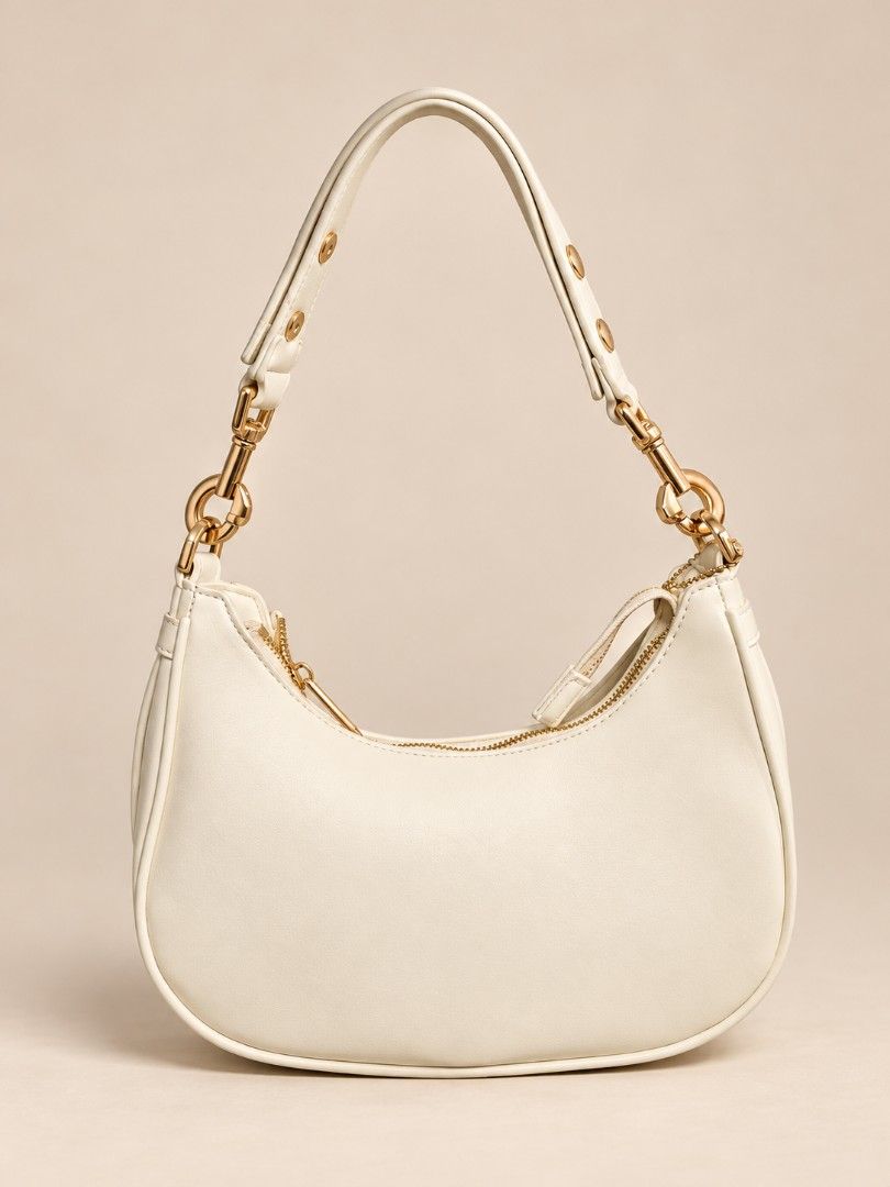 Cream Hobo Shoulder Bag with Gold Hardware (Category: Shoulder Bags) located in Pasig City. Submitted by lfboutique (Listing ID 1470769304, Image 1). Description: Pasig loc payment first or upon pickup - Color: Cream - Material: Smooth faux leather with chic gold-tone hardware - Closure: Secure top zipper closure - Design: Clean, minimalist curved silhouette - Size: Compact yet spacious enough for your daily essentials - Style: Versatile piece th