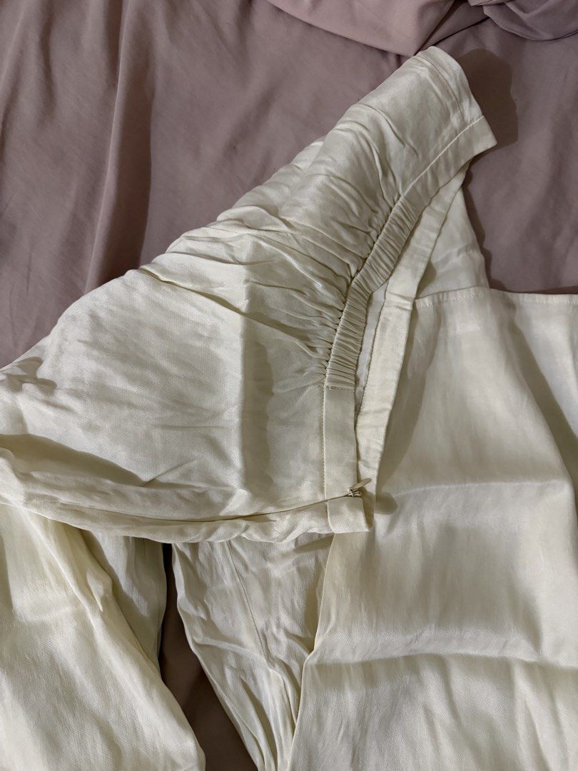 Cream Silk Wide Leg Pants (Category: Jeans) located in Makati City. Submitted by lvshop_mnl (Listing ID 1470879899, Image 2). Description: - Cream wide leg pants in a smooth, light, and flowy satin material - Waist measures approx. 16 inches across flat with a comfy elastic back waistband - Features a convenient side zipper closure - Great basic piece that is easy to dress up or down.