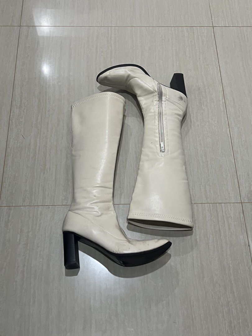Cream/Off White Knee High Leather Boots (Category: Boots) located in Paranaque City. Submitted by thriftymcgee (Listing ID 1470875636, Image 1). Description: Cream/Off White Knee High Leather Boots 🔻 RFS - Too Many Boots ! Size - EU 39 / US 8 Heel Height - 3 inches Calf Circumference - 31.5cm Perfect for your rush Halloween Costumes 🎃 Please check the photos for more details !.