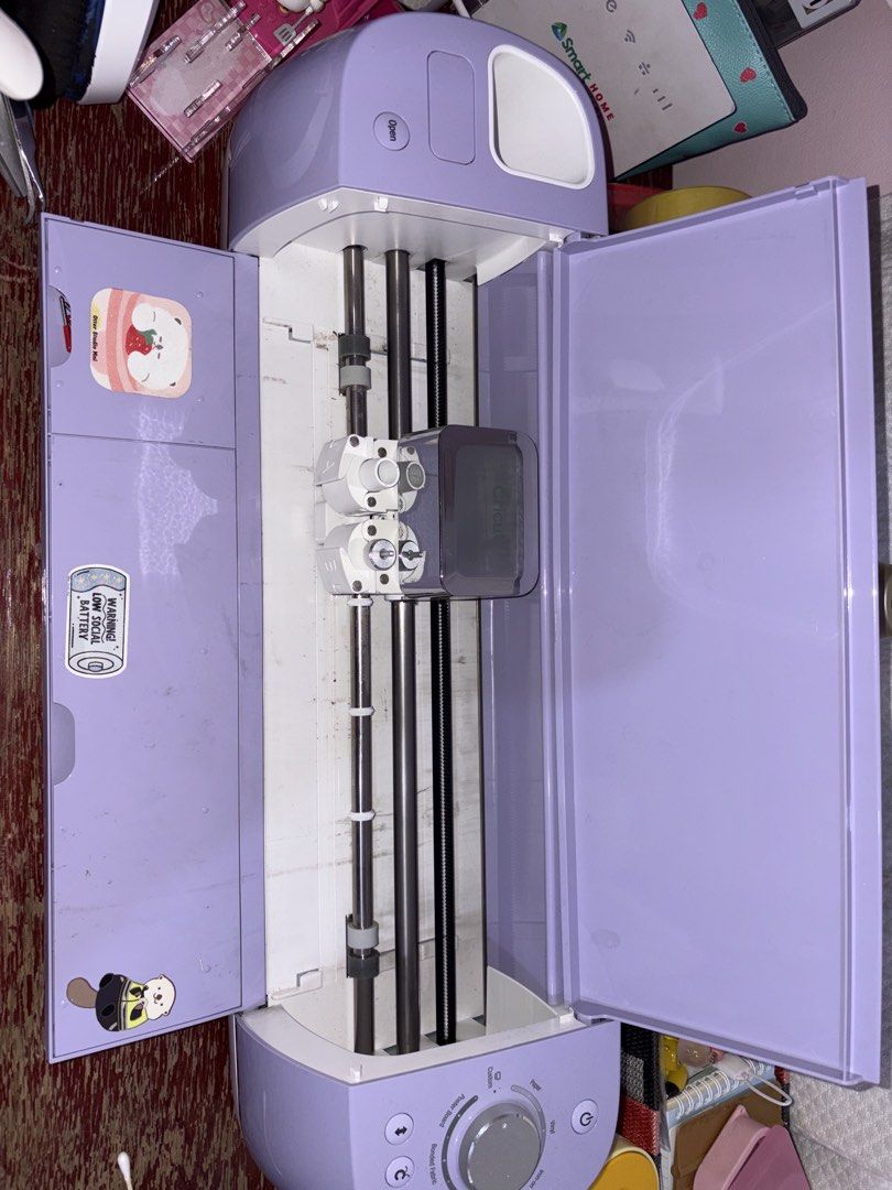 Cricut Explore Air 2 Purple Craft Machine (Category: Craft Supplies & Tools) located in Quezon City. Submitted by aly0017 (Listing ID 1470770897, Image 2). Description: - Purple Cricut Explore Air 2 electronic cutting machine - Ideal for vinyl, paper, and iron-on DIY projects - Features cute decorative stickers on the top lid and inner flap - Equipped with a dual carriage system - Clean metal rods and rollers, powers up with no issues - Includes: