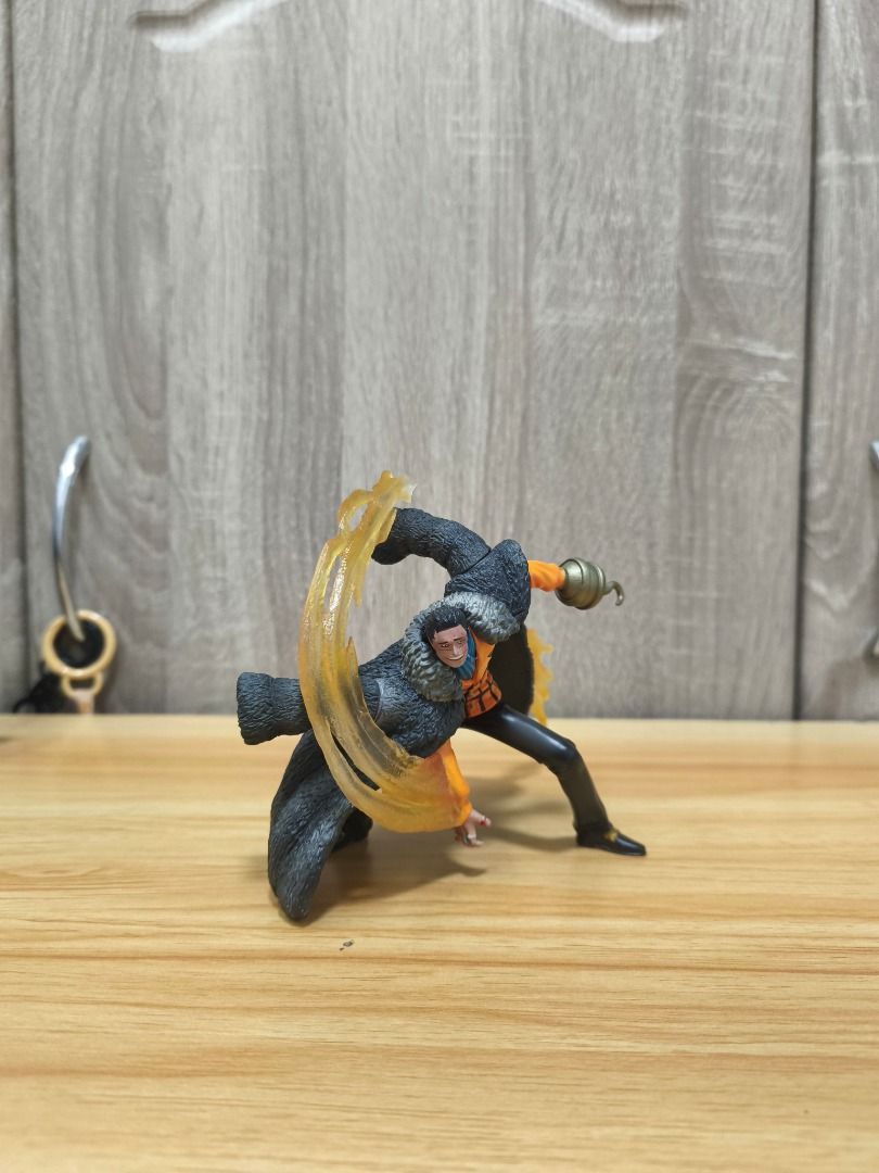 Crocodile - Super Effect Ability Figure Vol.2 (Category: Figurines & Statues) located in Santa Rosa. Submitted by tinytoycrate (Listing ID 1470924359, Image 1). Description: - Character: Crocodile from One Piece - Pose: Dynamic action pose with translucent yellow sand swirl effect - Details: Dark fur-trim coat, orange shirt, and iconic golden hook hand - Condition: Clean paint job and sturdy stance - Perfect for: Anime collectors and One Piece fa