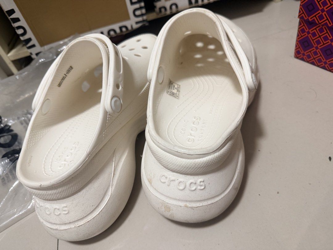 Crocs Classic Platform Clogs White W8 (Category: Slippers and slides) located in Marikina City. Submitted by ukayshopping (Listing ID 1470824328, Image 3). Description: - Item: White Crocs Platform Clogs - Size: Women's US 8 - Design: Iconic comfort, ventilation ports, and debossed brand lettering on heel strap - Origin: Made in Vietnam - Condition: Brand new, with minor dirt marks on soles and heel edges due to handling -Premium Copy.