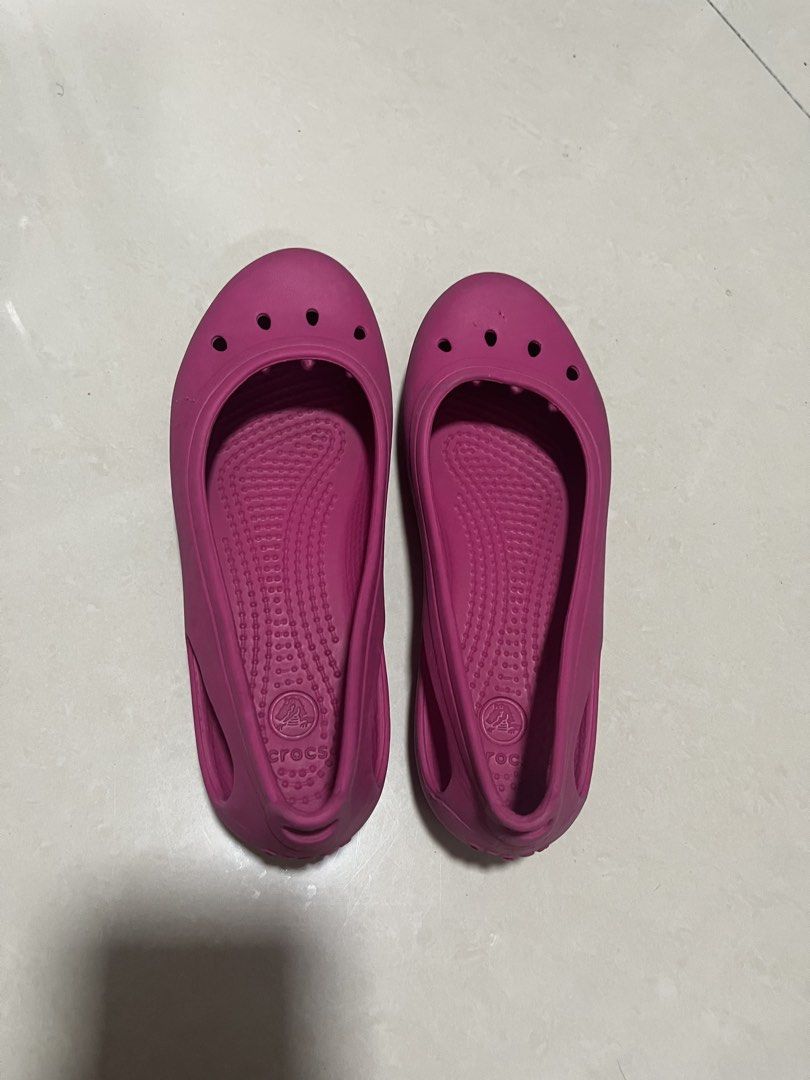 Crocs Pink Flats Shoes Size J1 (Category: Flats & Sandals) located in Pasig City. Submitted by uyin7 (Listing ID 1470872698, Image 1). Description: - Color: Bright pink - Style: Slip-on flats with front ventilation holes - Size: J1 - Material: Comfortable and easy-to-wash rubber - Origin: Made in Vietnam - Condition: Great for casual everyday wear.