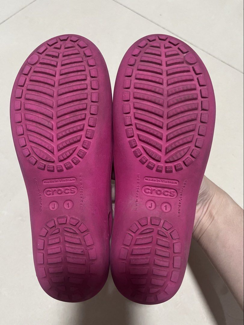 Crocs Pink Flats Shoes Size J1 (Category: Flats & Sandals) located in Pasig City. Submitted by uyin7 (Listing ID 1470872698, Image 2). Description: - Color: Bright pink - Style: Slip-on flats with front ventilation holes - Size: J1 - Material: Comfortable and easy-to-wash rubber - Origin: Made in Vietnam - Condition: Great for casual everyday wear.