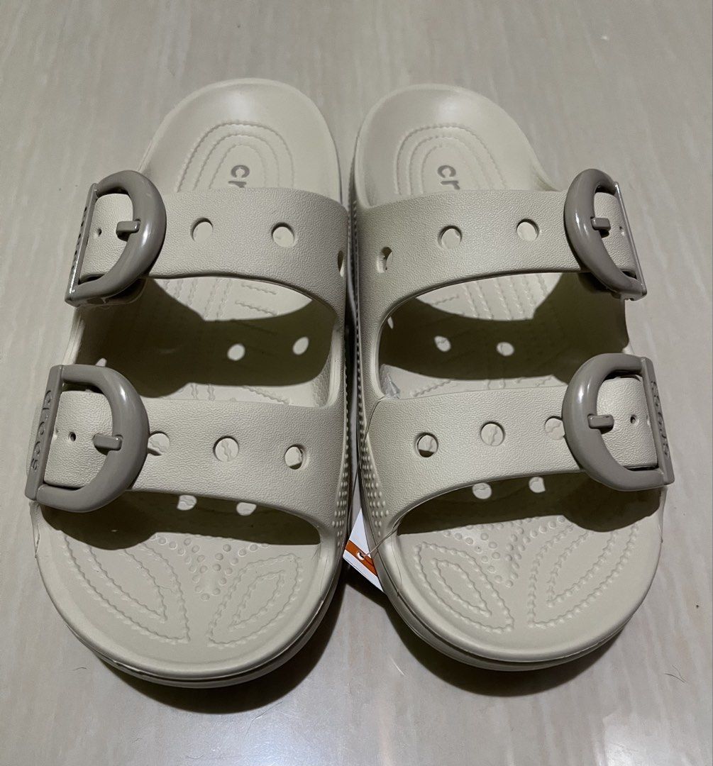 Crocs Saturday Enamel Buckle Sandals (Category: Flats & Sandals) located in Antipolo. Submitted by yosuke88 (Listing ID 1470765073, Image 2). Description: Brand: Crocs Style: Saturday Enamel Buckle Sandals Color: Frappe Size: W8 Condition: Brand new, unworn with tags Features: Double strap design, adjustable enamel buckles, side ventilation holes, and molded footbed Message me for more inquiries and pictures..