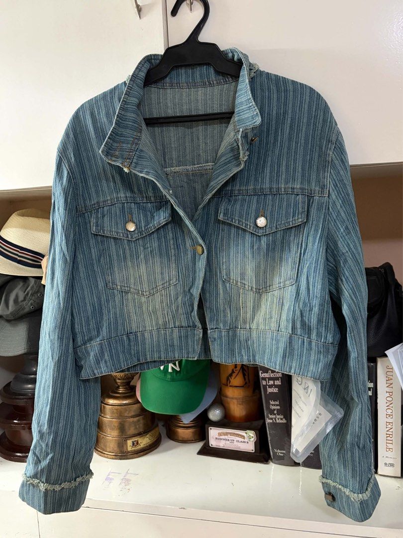 Cropped Blue Striped Denim Jacket with Pockets (Category: Coats, Jackets and Outerwear) located in Quezon City. Submitted by solarradaza (Listing ID 1470912171, Image 1). Description: - Style: Cropped denim jacket with subtle vertical stripes - Color: Light blue - Closure: Front button-up with metallic hardware - Pockets: Dual chest flap pockets - Details: Raw hem cuffs and short silhouette - Fit: Great for casual everyday layering.
