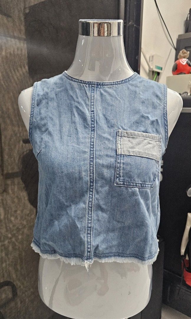 Cropped Denim Top (Category: Sleeveless) located in Manila. Submitted by dndgnzlz (Listing ID 1470875178, Image 1). Description: Brand: Asobio Size: small Light denim fabric Single back button for better neck/collar fit Payment first policy MOP: BPI, Gcash, Maya Courier: LBC, J&T, Lalamove, Grab.