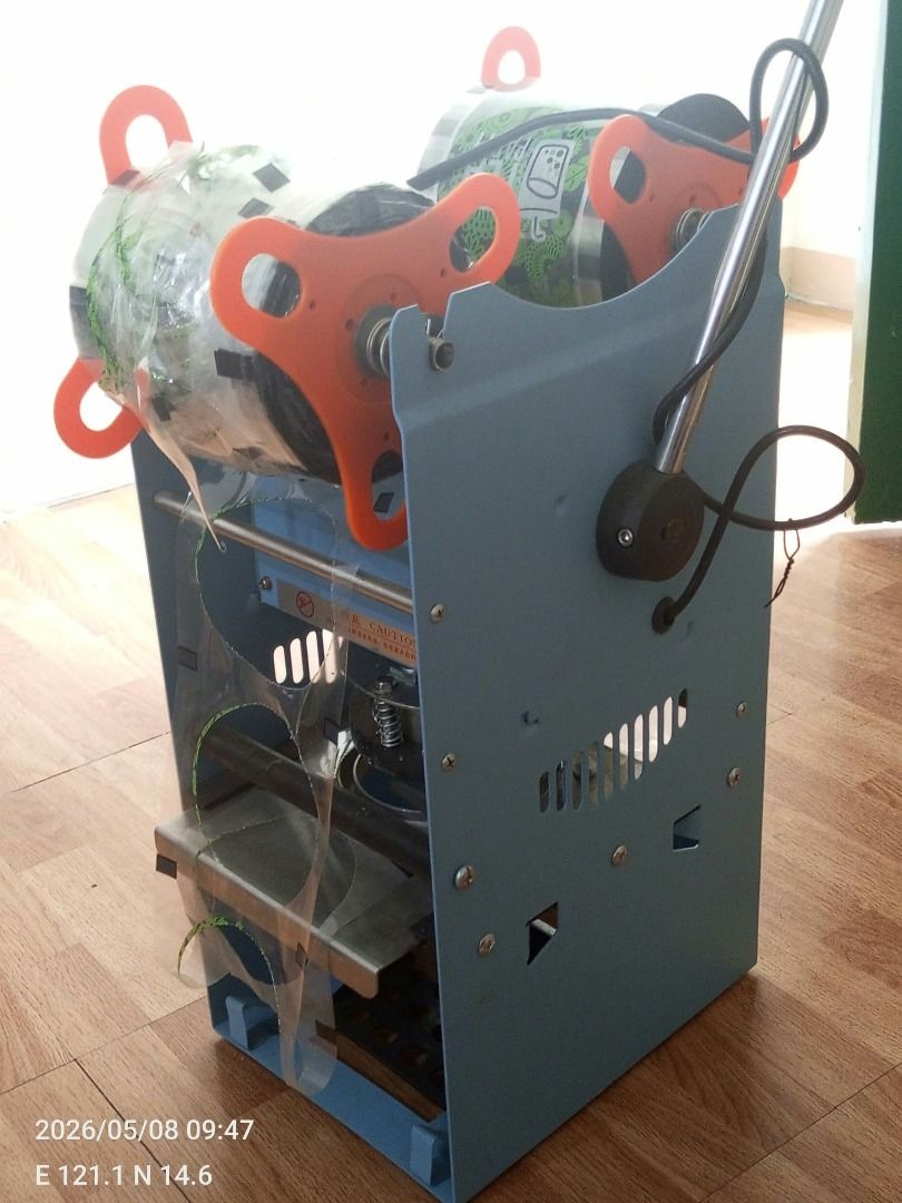 Cup Sealing Machine (Category: Coffee Machines & Makers) located in Caloocan City. Submitted by h00ud03 (Listing ID 1470924994, Image 3). Description: FOR SALE: Slightly Used Cup Sealing Machine – ₱4,000 (Negotiable) Selling due to business closure. Used for only a few months and still in good working condition! ✅ Semi-automatic cup sealer for milk tea, juice, and other beverages ✅ Slightly used and fully functional ✅ Includes remaining sealing f