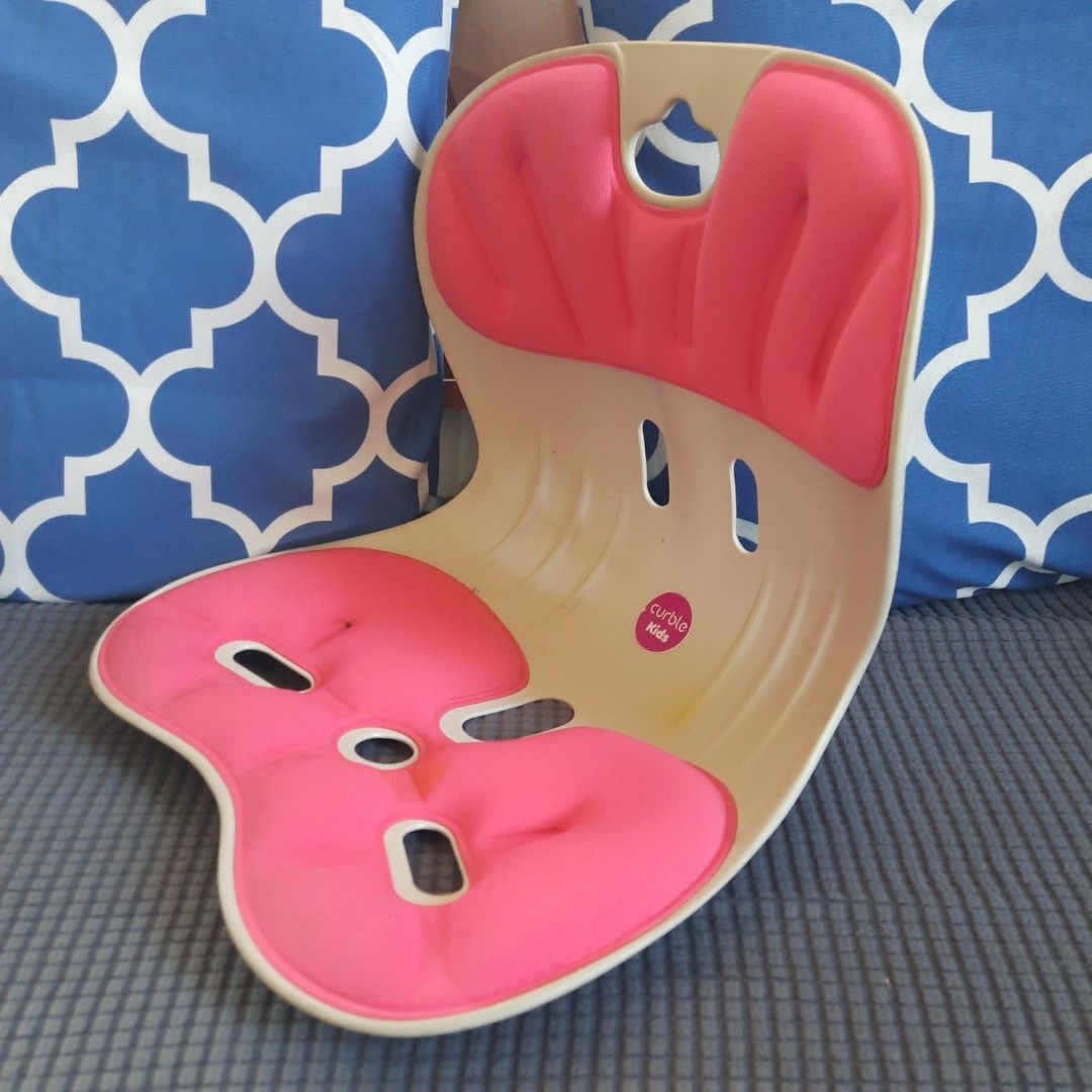 Curble Kids Posture Correcting Seat Cushion Pink (Category: Kids Tables & Chairs) located in Marilao. Submitted by mariealeiah (Listing ID 1470749927, Image 3). Description: - Pink and white Curble Kids ergonomic posture seat - Helps children maintain a straight posture during studying or meals - Contoured plastic shell with cooling ventilation slots - Supportive cushioned fabric pad with foam that holds its shape well - Condition: Shows some min