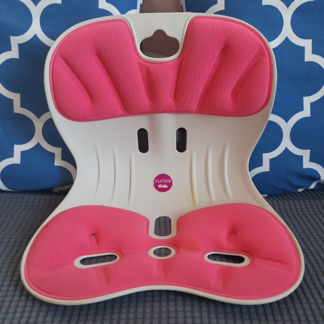 Curble Kids Posture Correcting Seat Cushion Pink (Category: Kids Tables & Chairs) located in Marilao. Submitted by mariealeiah (Listing ID 1470749927, Image 1). Description: - Pink and white Curble Kids ergonomic posture seat - Helps children maintain a straight posture during studying or meals - Contoured plastic shell with cooling ventilation slots - Supportive cushioned fabric pad with foam that holds its shape well - Condition: Shows some min