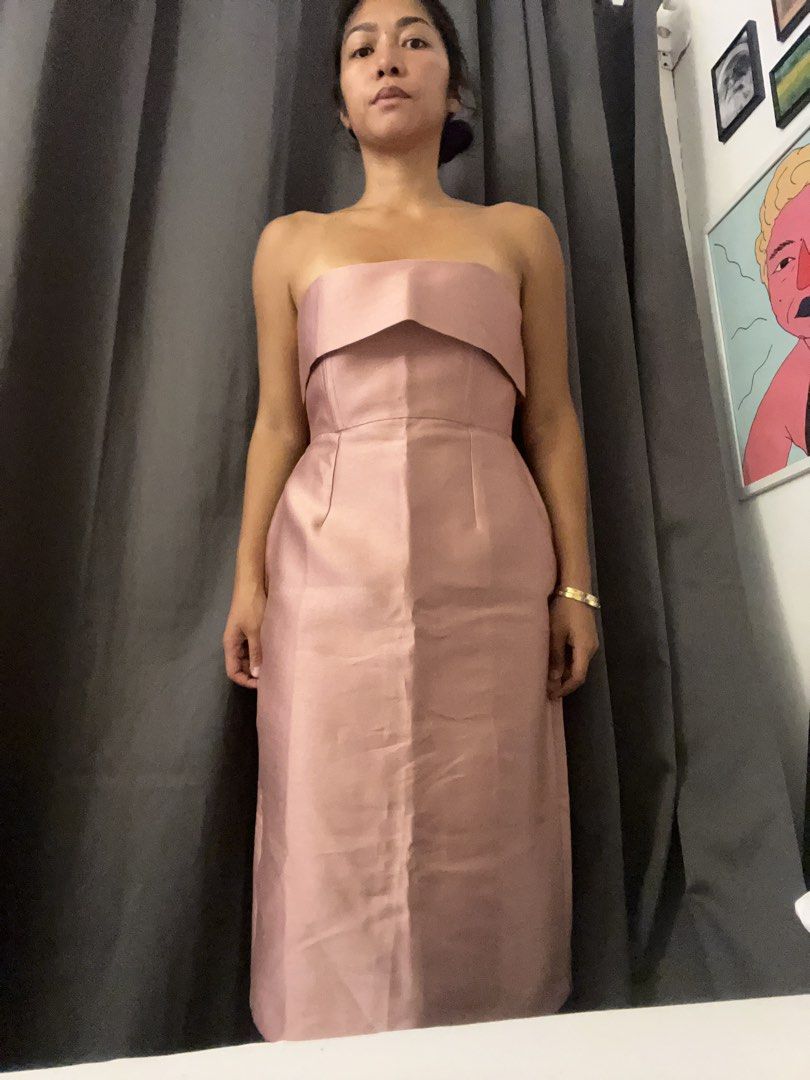 Custom Strapless Pink Midi Dress Gown (Category: Dresses) located in Paranaque City. Submitted by closetcore (Listing ID 1470825947, Image 1). Description: - Brand: June 12 The Label (Custom-made) - Condition: Brand new with tags, never worn - Color: Beautiful pink - Style: Minimalist strapless midi dress - Details: Structured bodice with a folded neckline - Custom clothing tag attached.
