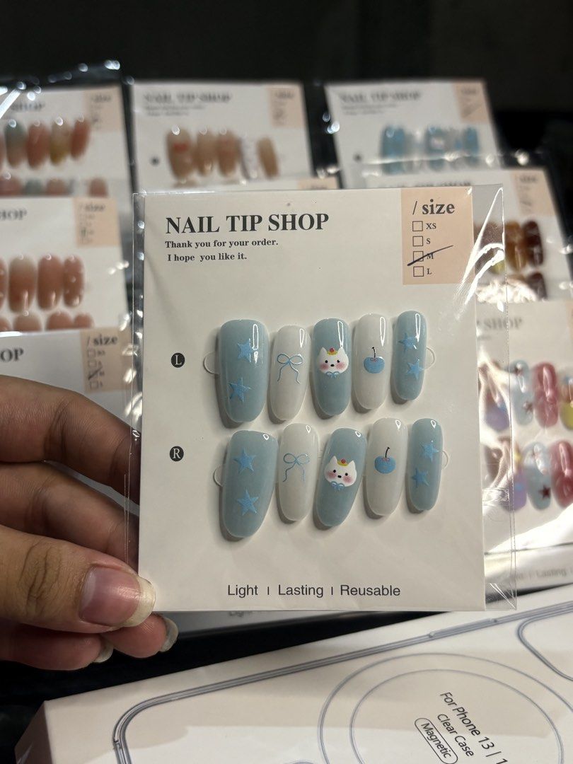 Cute Press-On Nail Tips - no glue nails only . (Category: Hands & Nails) located in Manila. Submitted by royalpengwen (Listing ID 1470791436, Image 2). Description: Wholesale price: 35 each 300 - 10pcs 375 - 15pcs 400 - 20pcs - Condition: Brand new / Unused in clean packaging - Size: random - Design: Cute pastel blue stars, bows, and little animals - Features: Lightweight, long-lasting, easy to apply and remove - Benefit: Perfect for quick salon-