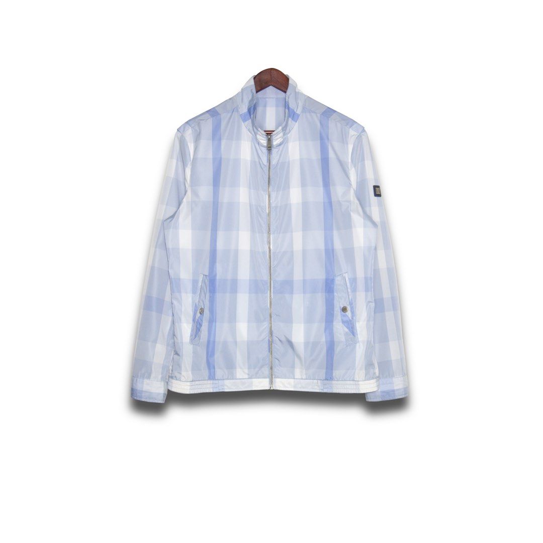 Daks Jacket (Category: Coats, Jackets and Outerwear) located in Davao. Submitted by justin_sells (Listing ID 1470808962, Image 1). Description: -Daks Jacket -Light blue and white plaid full-zip jacket with a high collar -Two front slash pockets with secure button snaps -Subtle dark patch logo on the left sleeve, plus ribbed cuffs and hem -Lightweight fabric, ideal for breezy days -Clean look that pairs easily with your favorite jeans.