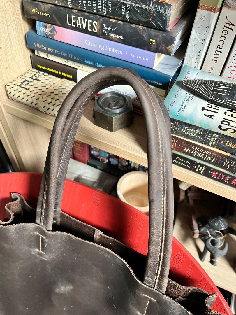 Dark Brown Leather Tote Bag with Shoulder Straps (Category: Tote Bags) located in Makati City. Submitted by Ina_Ndang (Listing ID 1470847266, Image 3). Description: Dark brown crazy horse leather bag Can be used as laptop bag or everyday work bag Very sturdy bag Removable long strap/handles and nylon-material pouch Corner rubs/scratches due to usage and storage Approx. dimension: 13" (W), 15" (H), 4" depth, 8.5" bag drop, 12" (W), 14" (H) removab