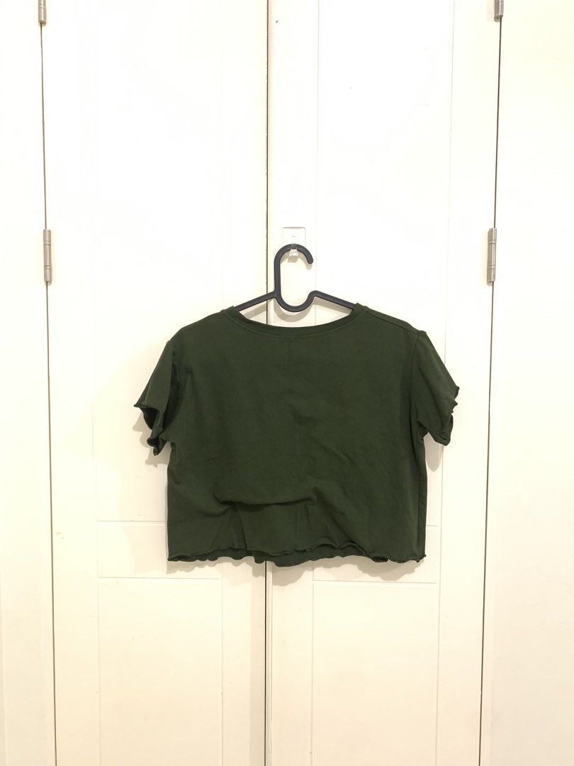 Dark Green Lettuce Hem Crop Top (Category: Sleeveless) located in Pasig City. Submitted by lovedbyri (Listing ID 1470871600, Image 3). Description: - Color: Dark Green - Style: Short-sleeve crop top with classic crew neck - Detail: Charming lettuce trim along the neckline and hemline - Fit: Perfect for pairing with high-waisted jeans or skirts - Comfort: Soft fabric ideal for daily wear - Condition: Clean and well-maintained.