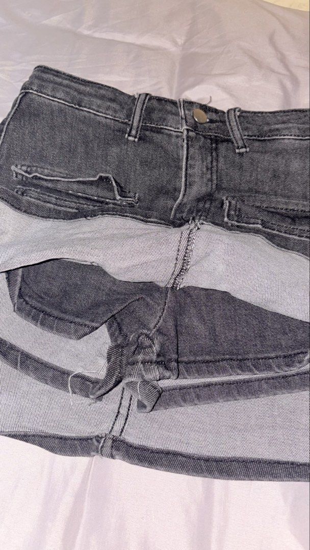 Dark grey denim cargo skort (Category: Skirts) located in Quezon City. Submitted by shrlane (Listing ID 1470889363, Image 3). Description: - Color/Wash: Dark grey acid wash - Size: L (tagged) but best fit 27-28waist - Fit: High-waisted with built-in shorts underneath - Details: Front patch pockets, front button closure, raw style finish - Style: Great staple piece for casual everyday outfits.