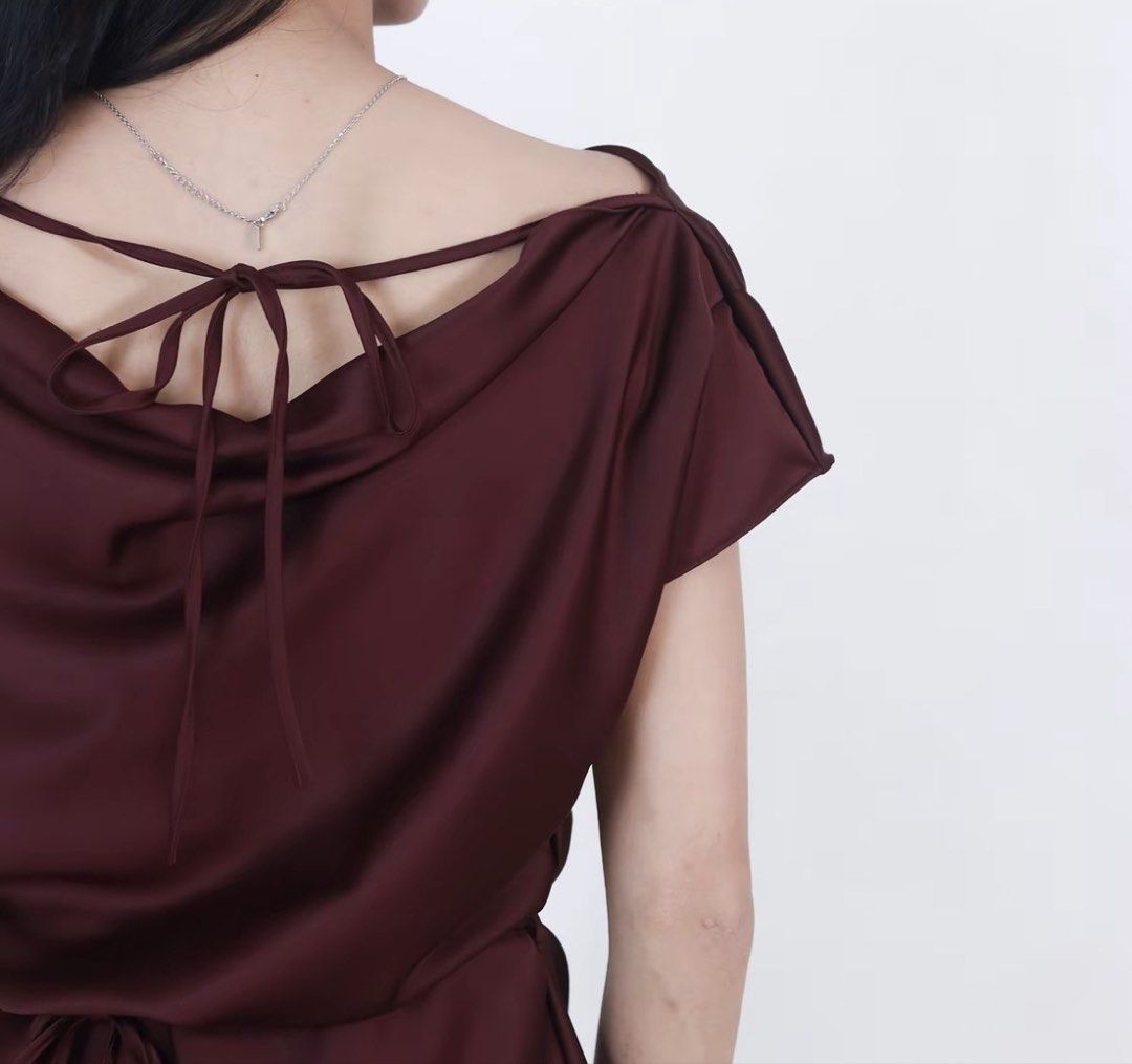 Dark Purple Satin Off-Shoulder Blouse with Back Tie (Category: Blouses) located in Manila. Submitted by clothesofitiew (Listing ID 1470774380, Image 3). Description: - Color: Dark purple with a subtle satin sheen - Neckline: Sleek off-shoulder design with short sleeves - Fit: Relaxed body fit with a built-in thin waist string to cinch the middle - Detail: Delicate thin tie closure at the upper back - Brand New - Size: M-L (check size chart in the