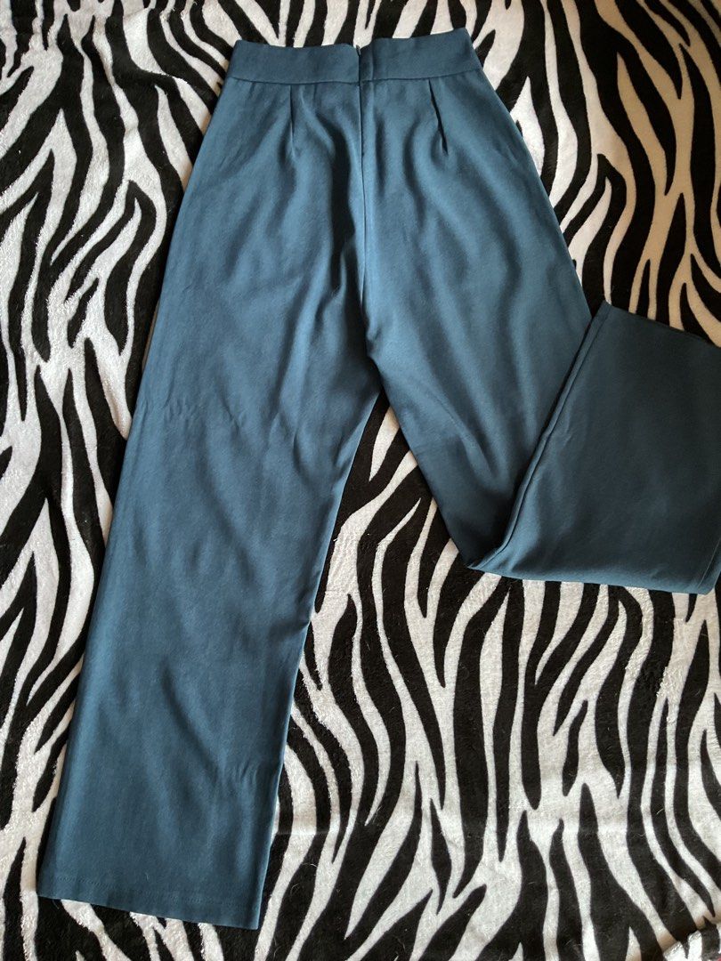 DarkBlue High-Waisted Wide Leg Pants (Category: Other Bottoms) located in Baguio. Submitted by prelovedbymb_11 (Listing ID 1470869995, Image 2). Description: - Color: Dark Blue - Fit: High-waisted with wide legs and clean flat front (no pockets) - Length: 38 inches -Waistline- 23-25 .