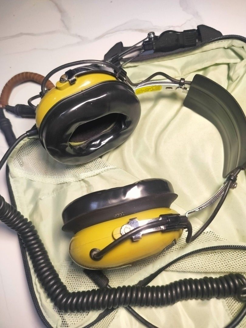David Clark H10-76 Military Headset (Authentic USA) (Category: Other Sports Equipment and Supplies) located in San Antonio. Submitted by lansbitshop (Listing ID 1470884410, Image 1). Description: Condition: Good used condition. Soft gel ear seals, clean headband, and crisp coiled cord. Own an iconic piece of American aviation gear. This authentic, USA-made David Clark H10-76 Military Aviation Headset is built like a tank for extreme noise isolati