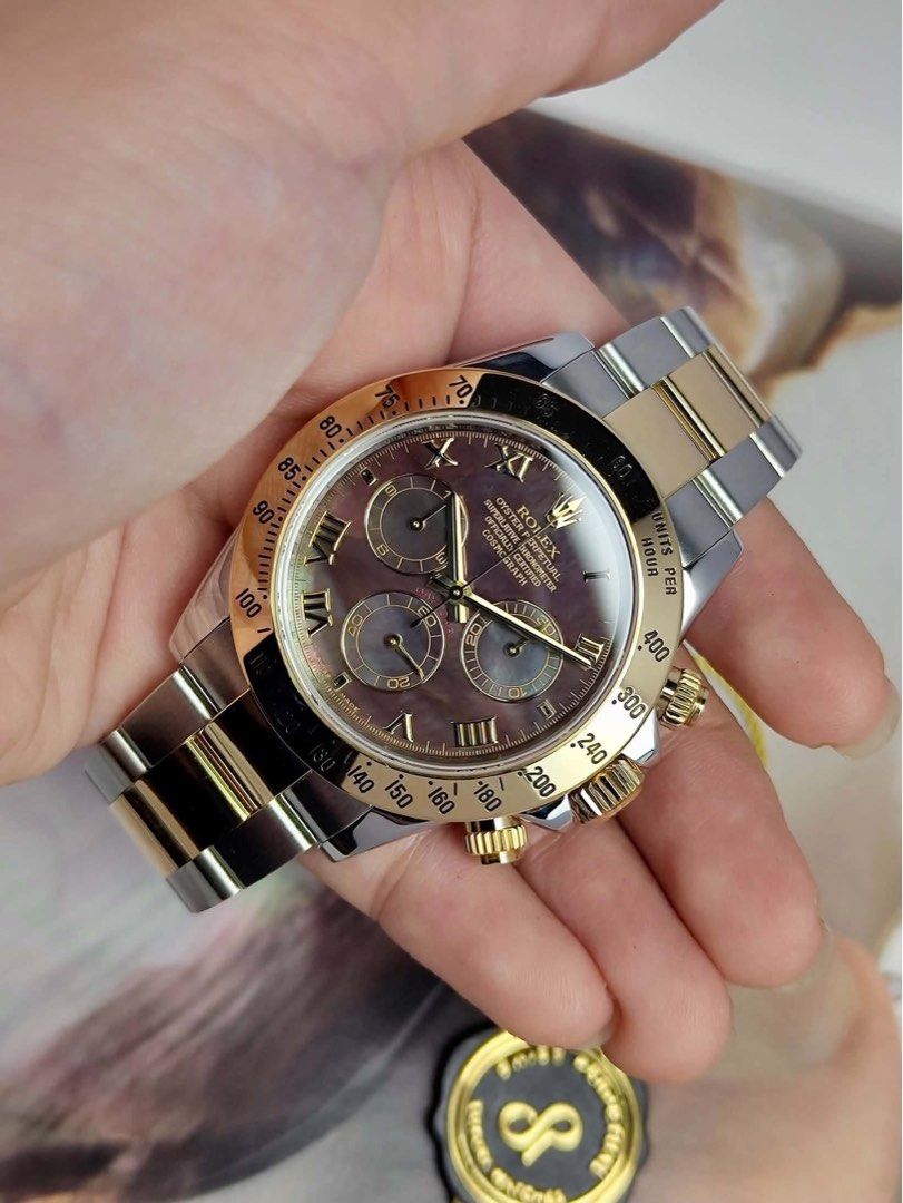 Daytona MOP Tahitian TT YG (Category: Men's Watches) located in Makati City. Submitted by swissperpetual (Listing ID 1470836629, Image 3). Description: Rolex Oyster Perpetual Daytona Cosmograph Mother of Pearl Tahitian (Dark Dial) Two Tone Yellow Gold 40mm 116523 Complete Set Condition: 9/10 (Excellent condition) Price: P1,248,000 Negotiable 🤝 7 Day Moneyback Guarantee 🧑‍🔧 1 Year SP Service Warranty 💱 Trades Offers and Pre-orders Accepted 💳 