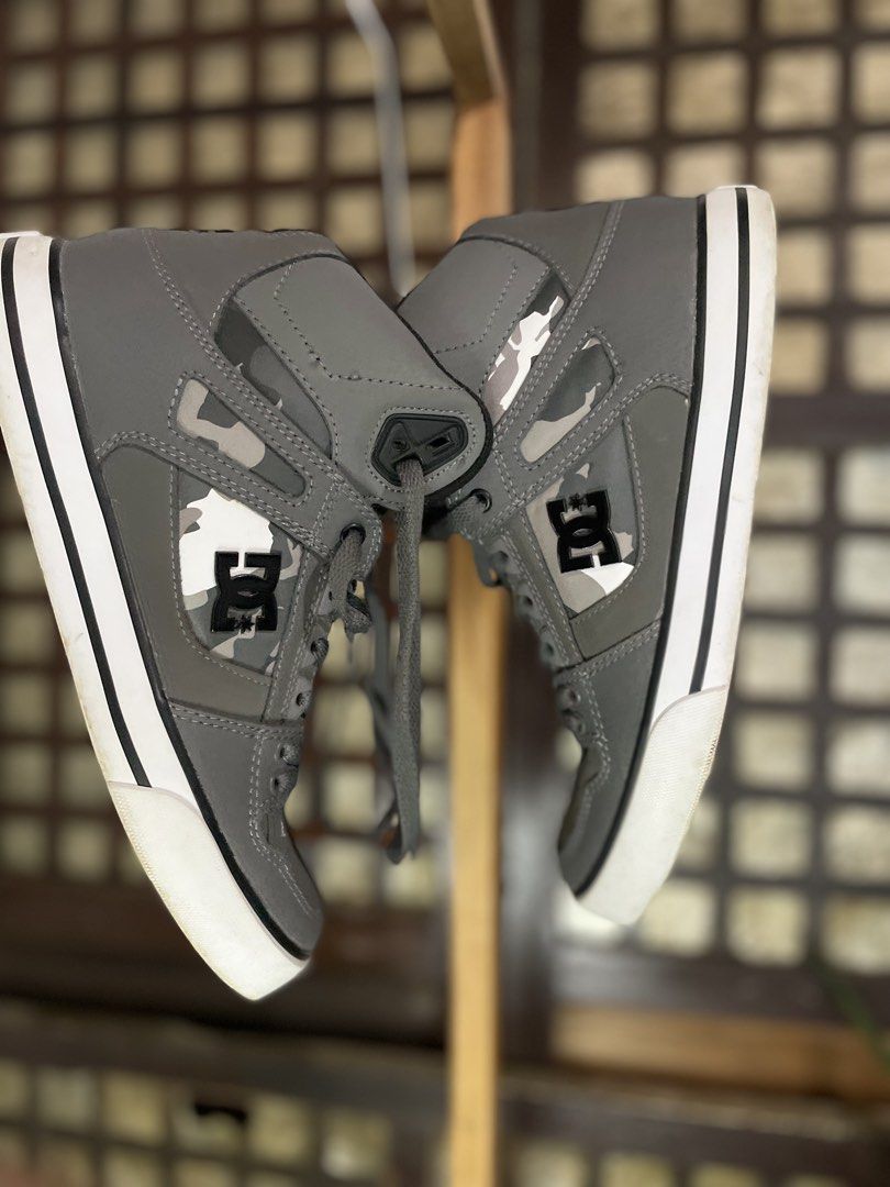 DC Shoes High Top Grey Camo (Category: Sneakers) located in Nampicuan. Submitted by aireann_10 (Listing ID 1470860746, Image 1). Description: - Brand: DC - Style: High-top sneakers - Color: Grey with camo side panels and black logos - Soles: White rubber with standard traction - Inclusions: Grey laces - Condition: Signs of wear on bottom treads and midsoles from regular use, but still lots of life left.