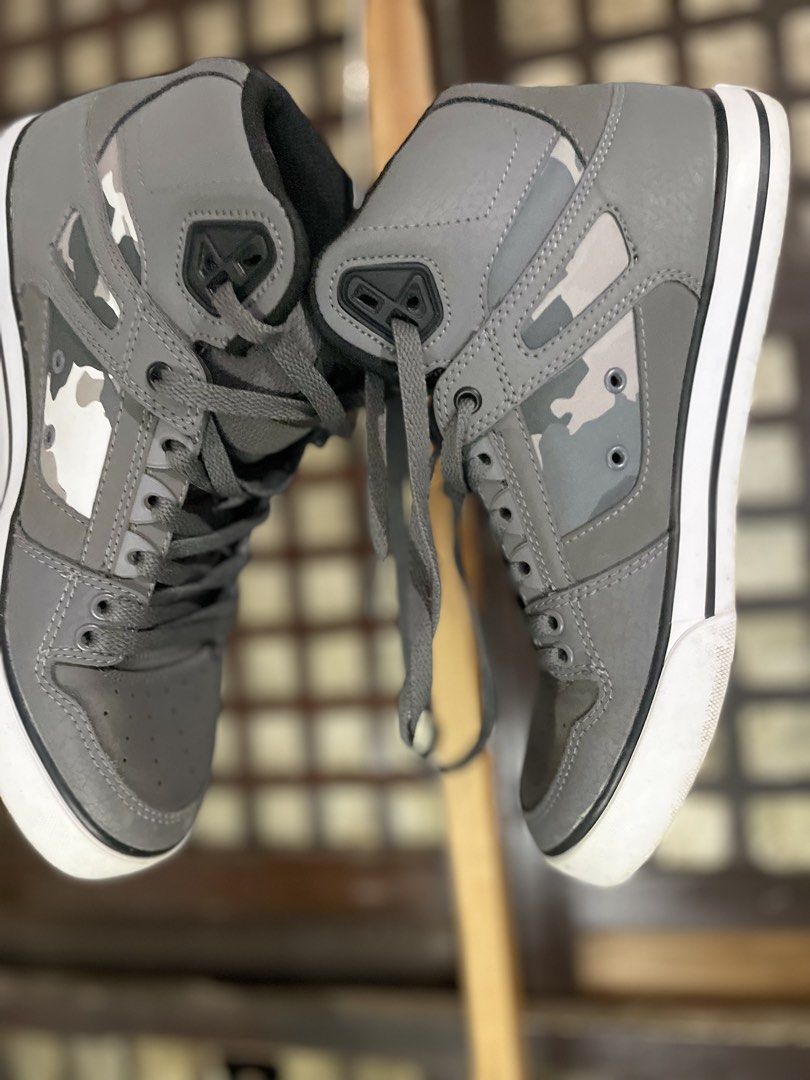 DC Shoes High Top Grey Camo (Category: Sneakers) located in Nampicuan. Submitted by aireann_10 (Listing ID 1470860746, Image 3). Description: - Brand: DC - Style: High-top sneakers - Color: Grey with camo side panels and black logos - Soles: White rubber with standard traction - Inclusions: Grey laces - Condition: Signs of wear on bottom treads and midsoles from regular use, but still lots of life left.