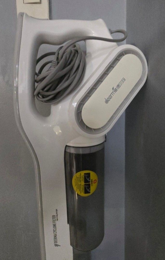 Deerma DX700 Vacuum cleaner (Category: Vacuum Cleaner & Housekeeping) located in Manila. Submitted by jhie24 (Listing ID 1470822833, Image 1). Description: - Brand/Model: Deerma DX700 - Color: Stylish White and Grey - Filtration: Cyclone filter dust cup for efficient cleaning. filter inside newly replaced. - Power Source: Standard electrical cord (plug-in) Includes wall hanger and other accesories price slightly negotiable.