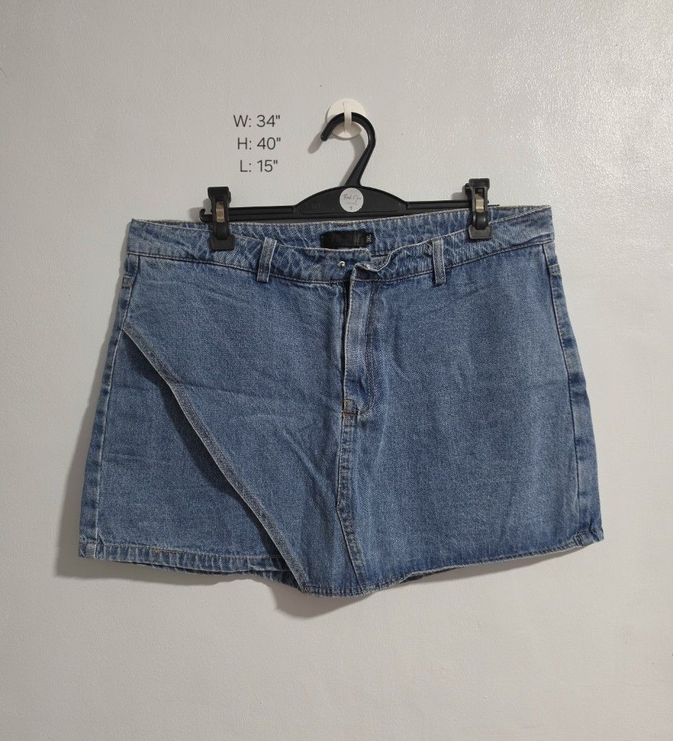Denim Skort Size 3XL Asymmetrical Wrap Shorts (Category: Skirts) located in Paranaque City. Submitted by franinnashop (Listing ID 1470841967, Image 1). Description: Declutter - Style: Denim skort with front skirt flap and built-in shorts - Wash: Mid blue - Size: 3XL (Waist: 34 inches, Length: 15 inches) - Design: Asymmetrical wrap front - Flaw: Missing button on the waistband (great DIY project or easy fix!) - Condition: Pre-loved, ready for a ne