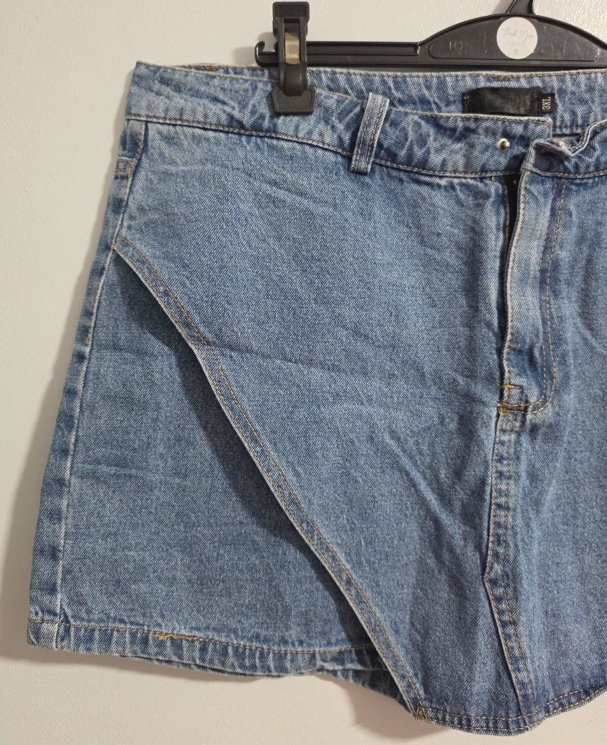 Denim Skort Size 3XL Asymmetrical Wrap Shorts (Category: Skirts) located in Paranaque City. Submitted by franinnashop (Listing ID 1470841967, Image 3). Description: Declutter - Style: Denim skort with front skirt flap and built-in shorts - Wash: Mid blue - Size: 3XL (Waist: 34 inches, Length: 15 inches) - Design: Asymmetrical wrap front - Flaw: Missing button on the waistband (great DIY project or easy fix!) - Condition: Pre-loved, ready for a ne